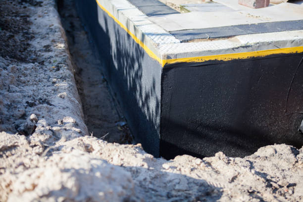 Professional Basement Waterproofing technician working in Perrysville, IN